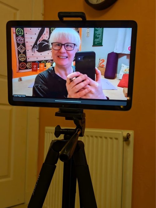 Stephanie joining a 1:1 session over Zoom from a tablet on a tripod